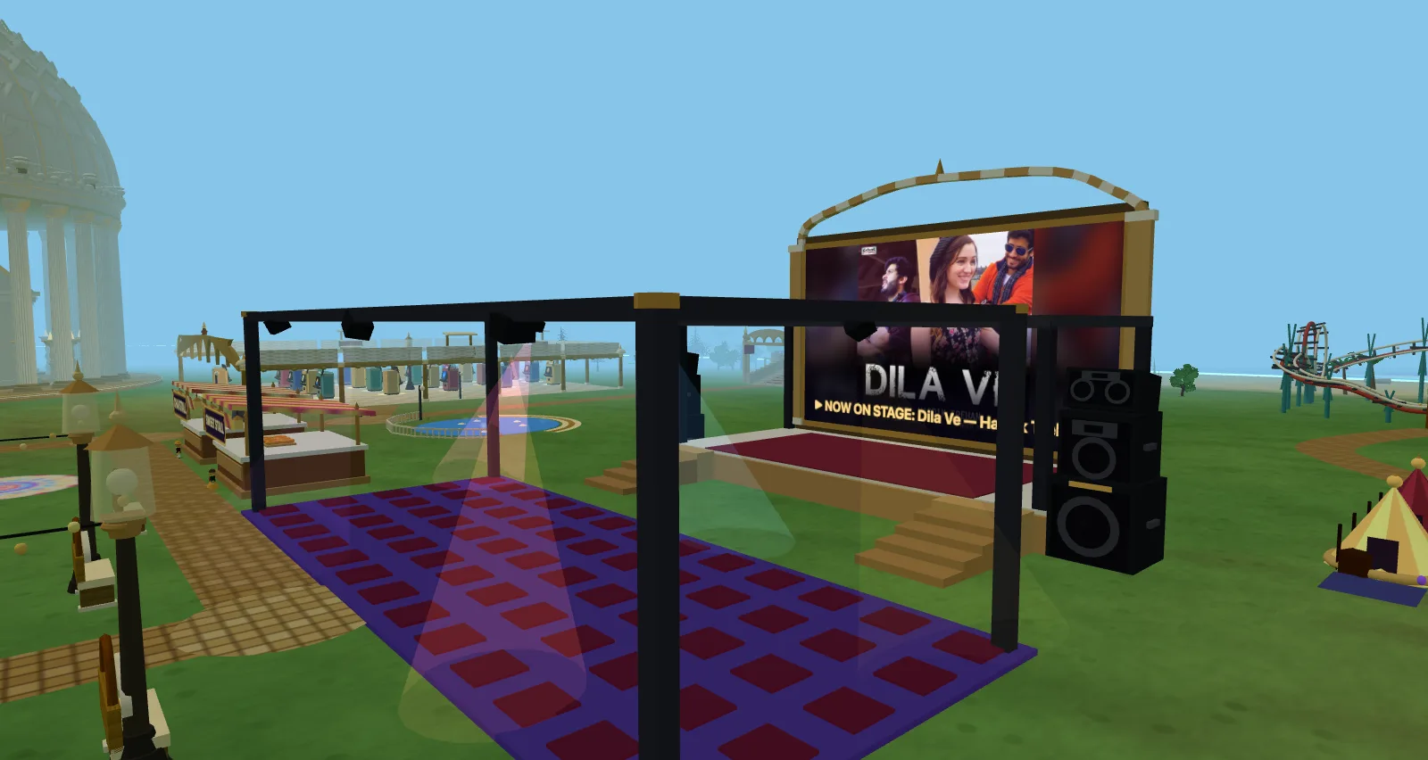 The festival grounds — the synced music stage playing now, the dance floor, chai and sweet stalls and the amphitheatre
